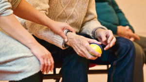 caregiver holding senior's arm