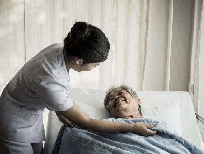 Lady in Hospital Bed